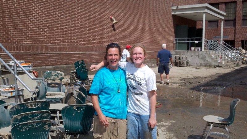 MIDDLEBURGH, NY - Michele Weaver, left, Middleburgh Central School District superintendent, with student Sunny Dickerson, 13. Flood waters destroyed the cafeteria, the computer lab, and a CAD facility. The new $77,000 track was also destroyed.